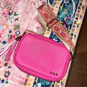 Vibrant Pink Crossbody Bag with Patterned Strap